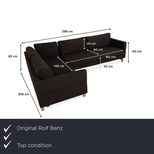 The Rolf Benz corner sofa is upholstered in a dark brown fabric and rests on stylish, sleek chrome legs, giving the sofa...