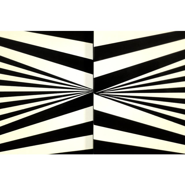 This modernist sideboard was produced in Scandinavia during the 1960s. It was finished with birch wood with irregular,...