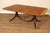 High Quality American Made Banded Mahogany Expandable Dining Table on Reeded Pedestals with Brass Feet and Rolling...