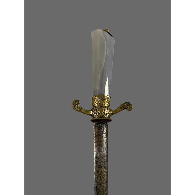 A magnificent hunting dagger. German work from the 17th century. The handle is made of faceted, milky blue chalcedony...