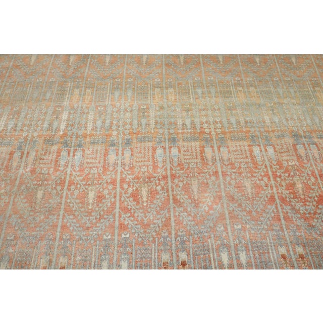 An early 20th Century Persian Bidjar Rug with an abrashed orange and red all over cypress tree motif throughout