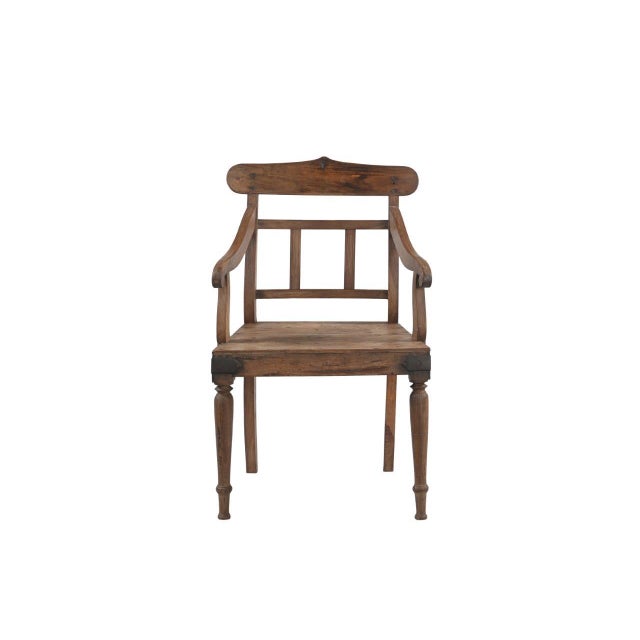This Vintage Anglo-Indian Teakwood Armchair is handcrafted from solid teakwood, featuring beautifully scrolled arms,...