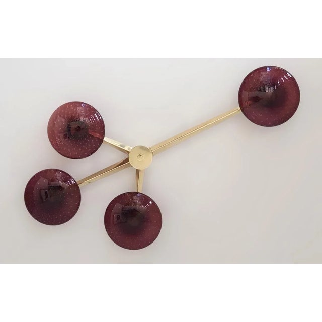 Italian flush mount with four amethyst Murano glass shades carefully hand blown with bubbles inside the glass using...