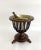 Beautiful oak Georgian Revival wine cooler or jardiniere with original brass bucket. Elegant vase shape with curved slats...