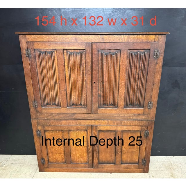 A very clean Narrow Oak Hall cupboard. Having 4 doors the top with nice linenfold carved panels. It comes apart into 2...