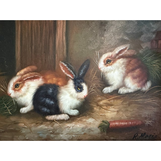 A delightful original vintage oil painting on wood board, signed R. Mario, depicting three adorable rabbits gathered in a...