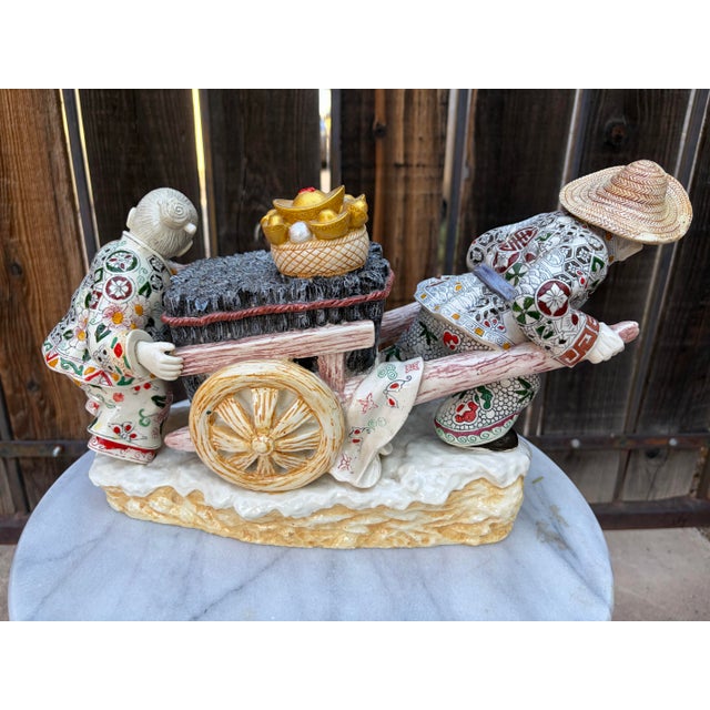 ## Title Vintage Italian Chinoiserie Faux Alabaster Prosperity Cart Sculpture ## Description A substantial and intricately...