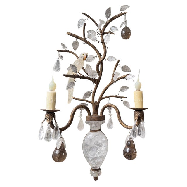 A spectacular and highly decorative pair of French Maison Baguès style two-light wall sconces, circa 1980s, conceived as...