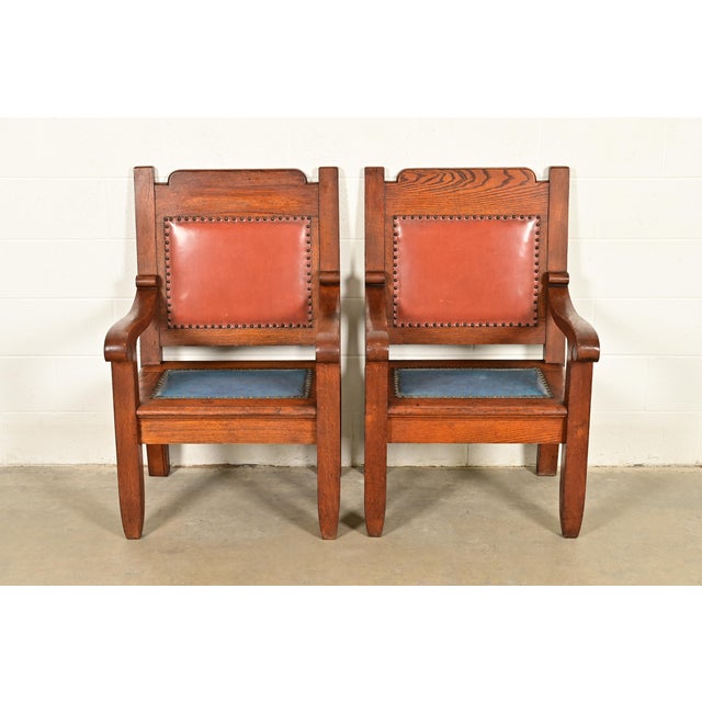 A gorgeous pair of antique Mission or Arts & Crafts period club chairs, library chairs, or armchairs In the manner of...