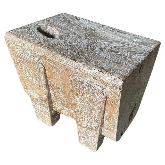 Impressive thirteen inch thick log floats four inches off the floor on minimalist cut out legs. We added a cerused finish...