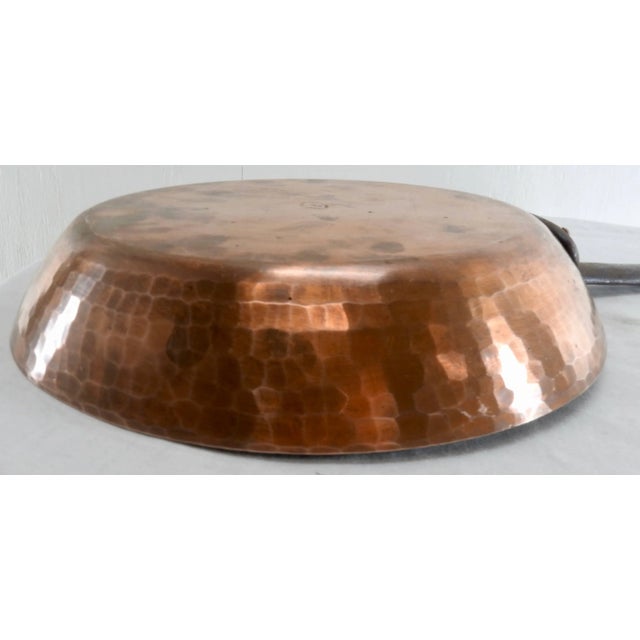 Hammered copper gives this frying pan character. A long cast iron handle is attached. The pan is marked "Made In France"...