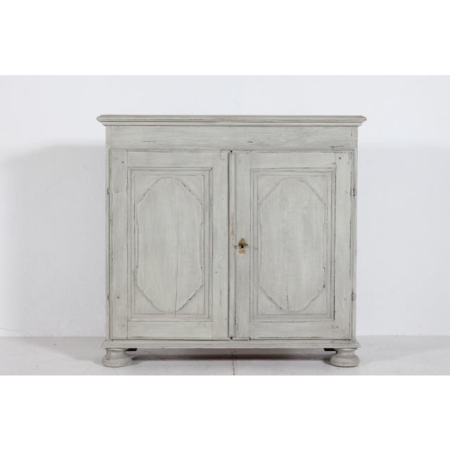 Antique baroque storage cabinet with 2 doors and shelves. with fine profiled carvings on the doors which are typical of...