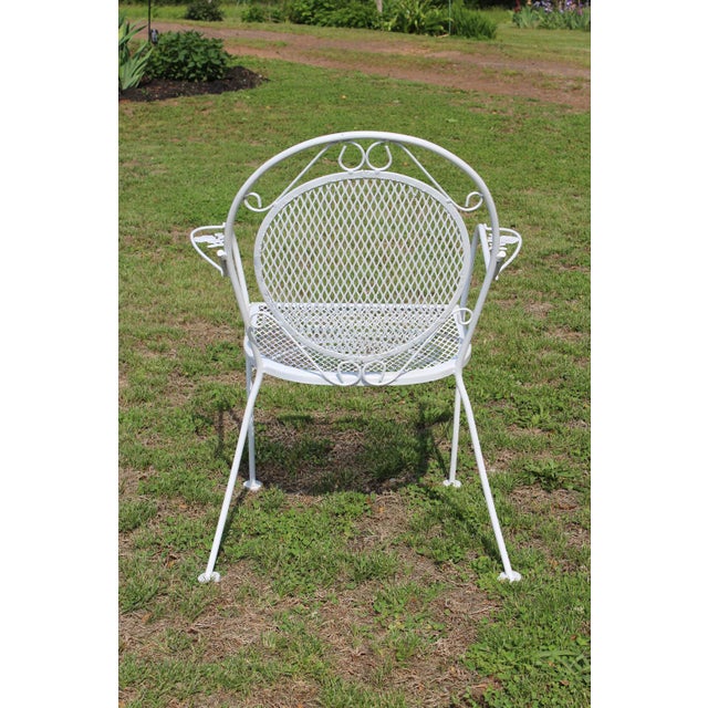 1970s Wrought Iron Patio Set—Four Armchairs and a Table With a Glass Top For Sale - Image 5 of 18