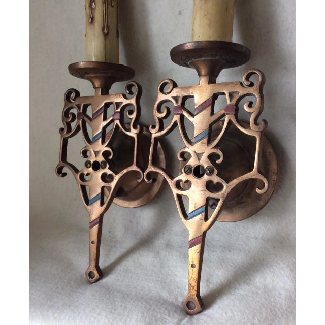 A nice pair of Antique bronze wall Sconces. The sconces have an elegant design and would fit into an Arts & Crafts, Art...