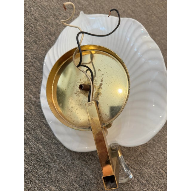 Illuminate your space with timeless sophistication using this pair of Murano glass wall sconces, each meticulously...