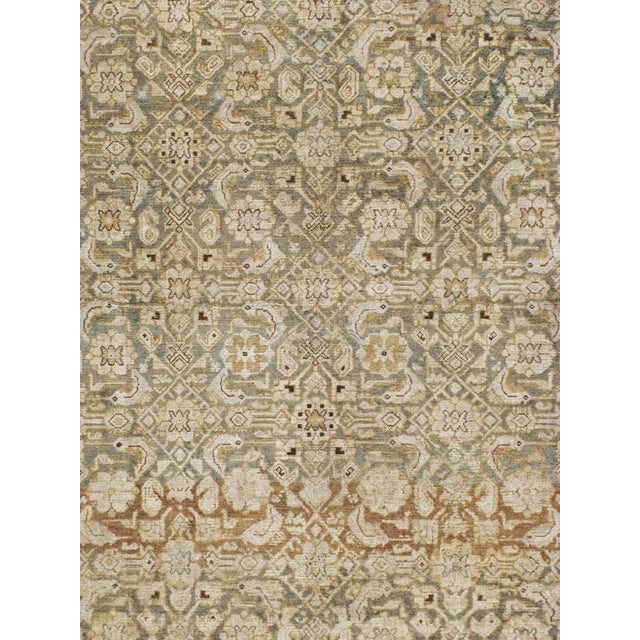 An antique Persian Malayer carpet from the early 20th century. Measures: 8' 7" x 12' 9"