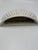 A charming vintage ceramic wall pocket modeled as a stylized scallop shell, featuring a crisp white glazed finish with...
