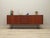 The sideboard was made in the 1970s, Danish production. The structure is covered with teak veneer. Legs made of metal...