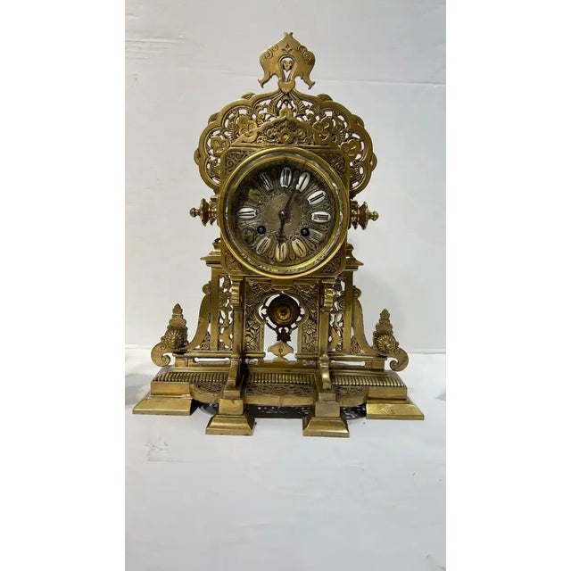 French Mantel Clock and Candelabra Garniture in Islamic Style, circa 1880s. Clock measures 13.5 by 10.5 by 6 inches...