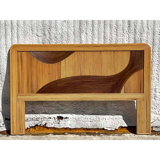 A fantastic vintage Coastal Queen headboard. A chic biomorphic design in two shades of pencil reed. Acquired from a Palm...