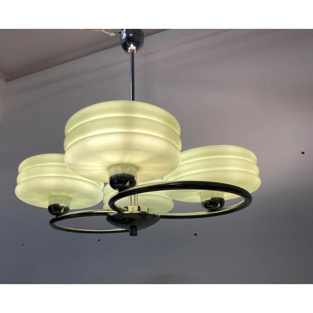 This Art Deco style pendant light was designed between 1920-1949, and manufactured in Czechoslovakia. It features a steel...