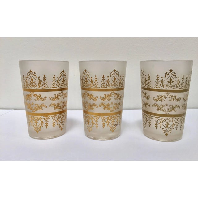 Set of six Moroccan opaline white and gold glasses. Decorated with a classical traditional Moorish pattern frieze. Use...