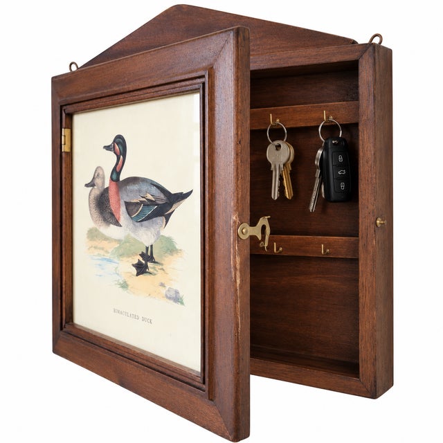 Charming vintage Italian wall-mounted cabinet combining decorative sporting art with practical key storage. Crafted in...