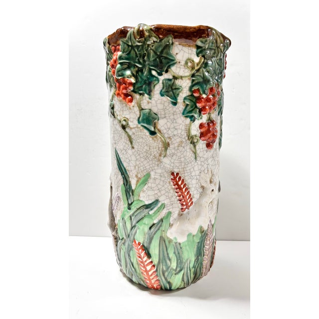 Antique majolica umbrella stand featuring raised rabbits, grape clusters, trailing vines and deeply modeled foliage in...