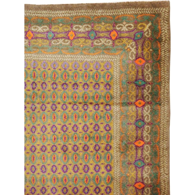 A vintage Indian Lahore carpet from the second quarter of the 20th century; part of a conglomerate of rugs influenced by...