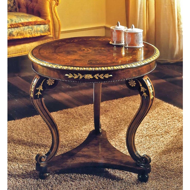 Handcrafted in Italy, this round lamp table features walnut burl veneers accented with satinwood inlays and hand-carved...