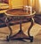 Handcrafted in Italy, this round lamp table features walnut burl veneers accented with satinwood inlays and hand-carved...