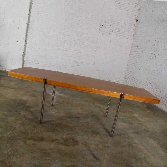 Fabulous modern boat shaped dining table or conference table by Jens Risom for Howe Furniture. Comprised of walnut veneer...