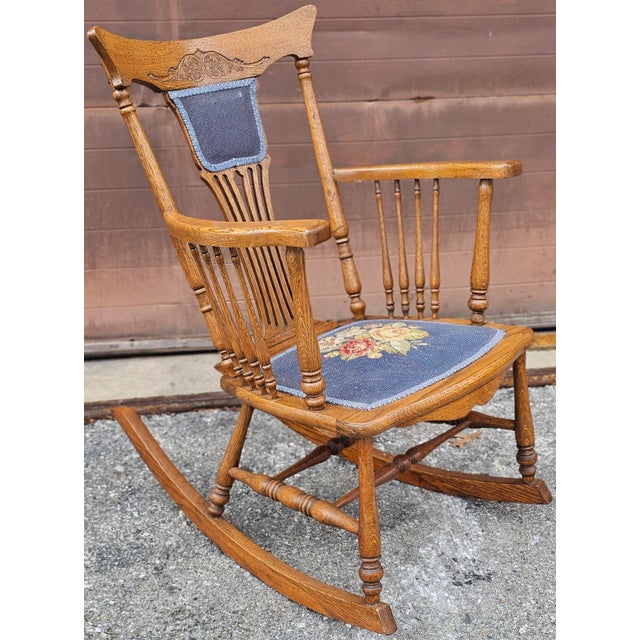 An Early 20th Century Victorian Arts and Crafts Style Pressback Oak and Needlepoint Upholstered Rocking Chair in great...