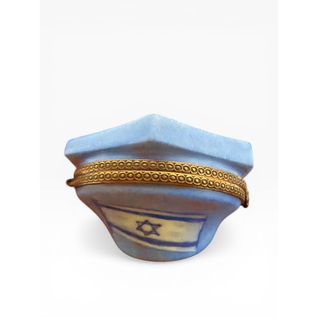 A finely executed and highly detailed hand-painted Limoges porcelain trinket box, crafted in France and decorated with a...