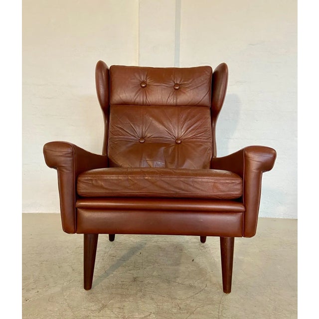 vintage danish mid-century svend skipper lounge chair in caramel brown leather introducing an exquisite piece of danish...