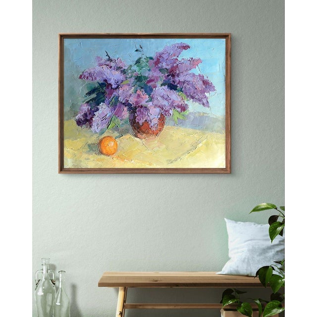 The painting titled ""Lilac and Tangerine"" is a delicate and vibrant still-life composition that captures the harmony of...