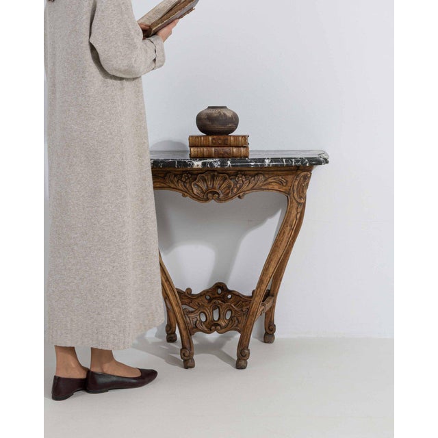 This piece presents as a table, distinguished by natural honey oak, carved openwork stretcher. The piece dates to Early...