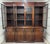 A superb quality early 19th Century mahogany breakfront bookcase, the stepped moulded cornice above four large glazed...