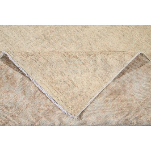 Beautiful modern Peshawar Pakistani hand-knotted wool rug with a beige field. This Oushak rug has blue accents all over a...