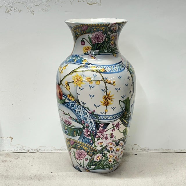 Offering this large Italian vase with a floral print among various pieces of blue and white china. Measures 10” diameter x...