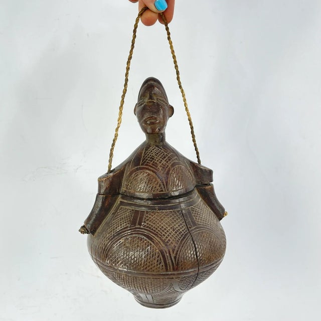 Kuba wood containers from the Congo are exquisite examples of traditional craftsmanship and artistic expression. Made by...
