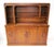 A very well crafted two- piece bar cabinet in a medium dark walnut tone having a pull- down door with copper surface for...