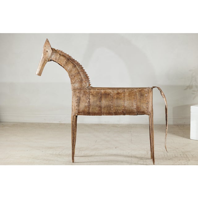 "About the Item A striking vintage Indian horse sculpture handcrafted from riveted iron panels, this piece captures both...