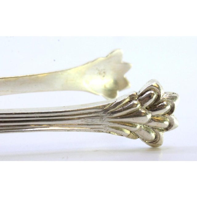 Silver Sugar Tongs with Shell-Shaped Reliefs and Claw-Shaped Tongs, in Very Good conditions. Designed 1890 to 1919 This...