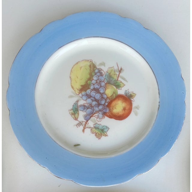 Fresh from farm to hanging on the wall above your table. This whimsical group of plates features fruit in cheerful sky...