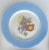 This curation of seven vintage decorative plates features vibrant artwork of fruit. Sky blue and orange are the main...