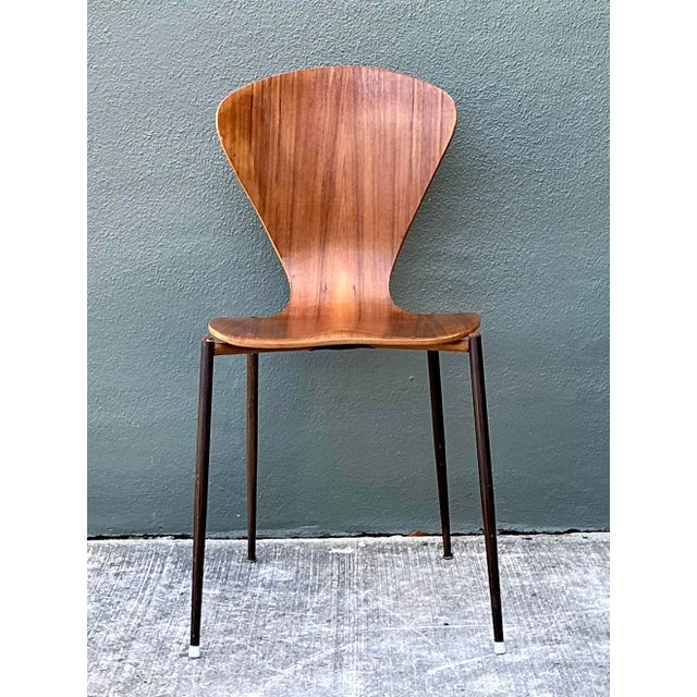 This iconic Danish Modern side chair is a masterwork of Mid-Century design, drawing direct inspiration from Arne...