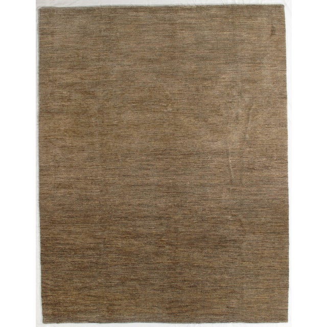 Vintage hand-knotted Pakistani Gabbeh rug featuring a minimalist field with subtle tonal variation and soft abrash. Gabbeh...