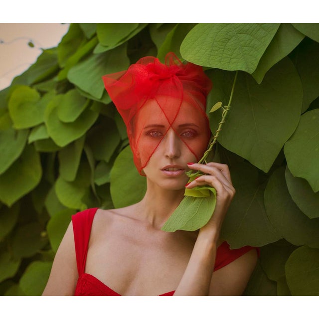 Royal Tea Grace by Dasha and Mari Lady in red, a model poses under a vibrant veil in nature, 2019. Limited edition print...