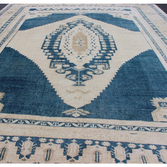 Textile Vintage Hand Knotted Turkish Oushak Rug With Central Medallion in Blue and Cream For Sale - Image 7 of 13
